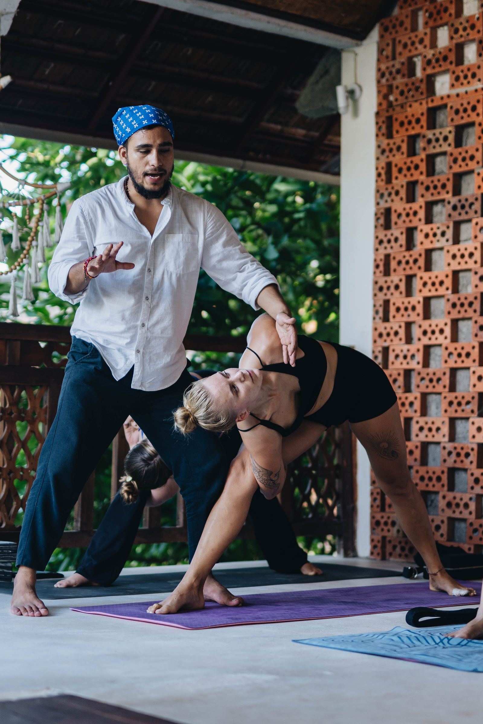 Hands-on adjustment during a standing side-bend