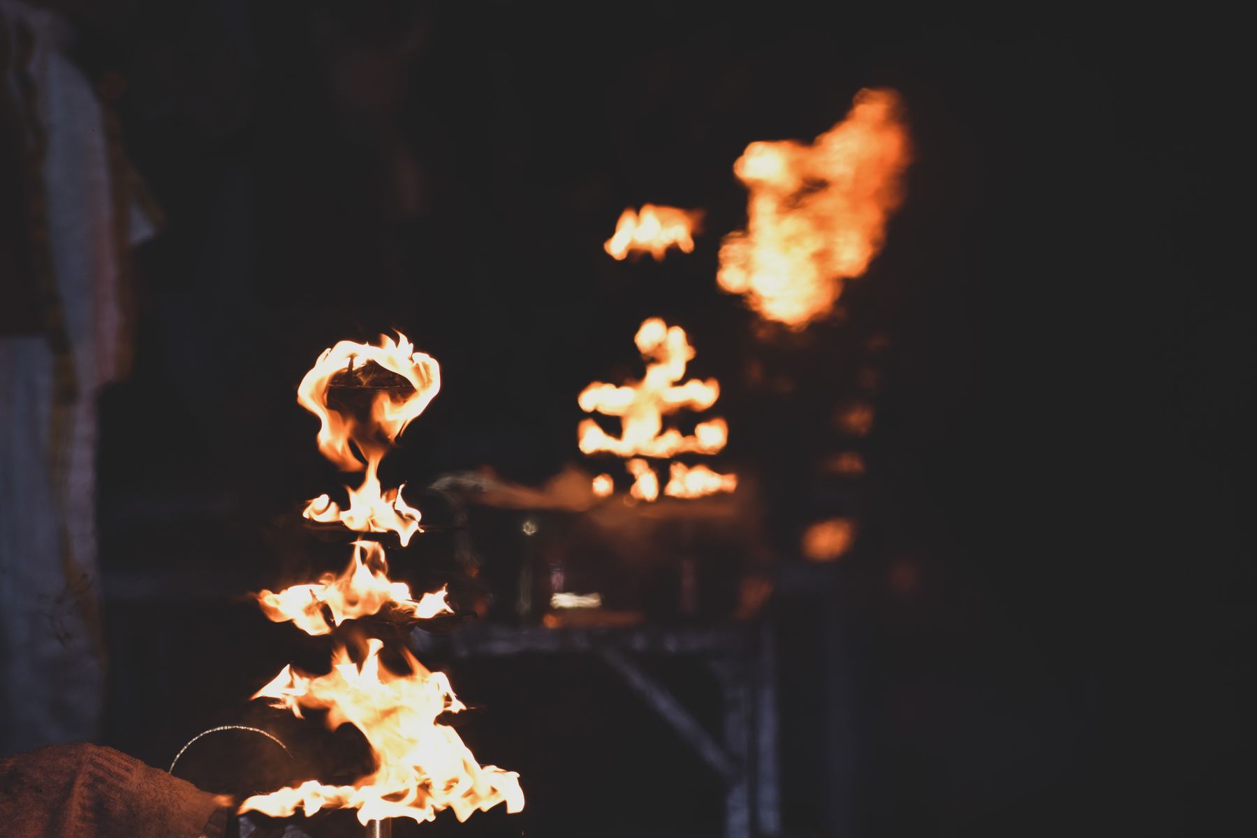 Tiered fire lamps at the evening Ganga Aarti ceremony in Rishikesh