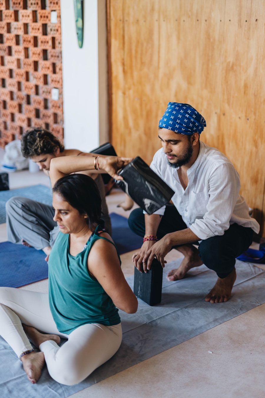 Assisting a student in a leg stretch